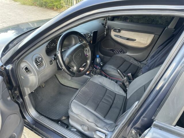 Черный Дэу Нубира, объемом двигателя 1.6 л и пробегом 258 тыс. км за 2000 $, фото 9 на Automoto.ua