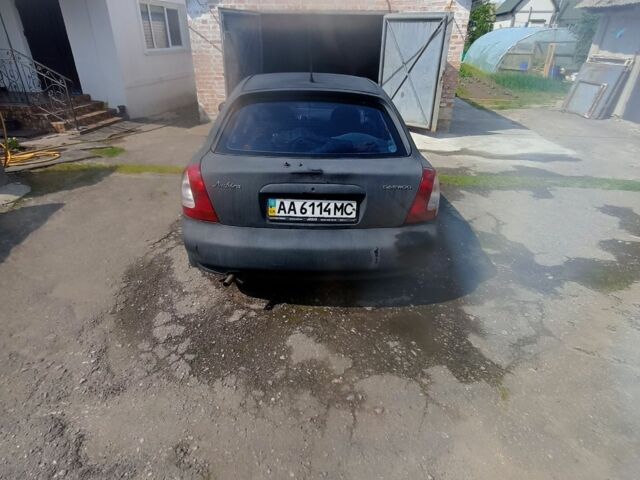 Черный Дэу Нубира, объемом двигателя 1.6 л и пробегом 230 тыс. км за 790 $, фото 6 на Automoto.ua