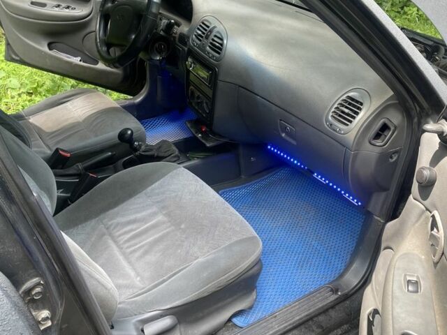 Черный Дэу Нубира, объемом двигателя 1.6 л и пробегом 235 тыс. км за 700 $, фото 3 на Automoto.ua