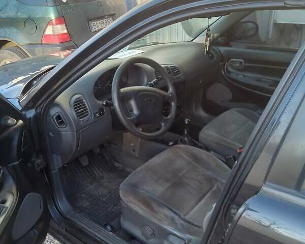 Чорний Деу Нубіра, об'ємом двигуна 1.6 л та пробігом 390 тис. км за 1100 $, фото 2 на Automoto.ua