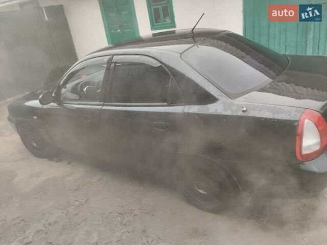 Черный Дэу Нубира, объемом двигателя 0 л и пробегом 310 тыс. км за 2000 $, фото 3 на Automoto.ua