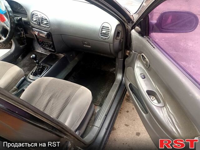 Чорний Деу Нубіра, об'ємом двигуна 1.6 л та пробігом 111 тис. км за 1111 $, фото 8 на Automoto.ua