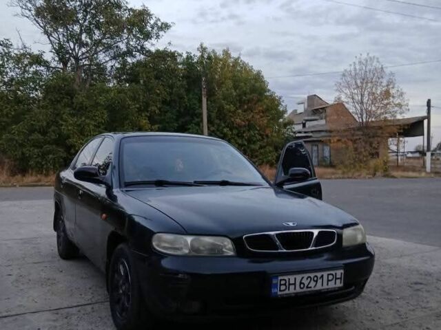 Черный Дэу Нубира, объемом двигателя 1.6 л и пробегом 300 тыс. км за 1000 $, фото 4 на Automoto.ua