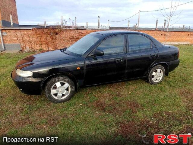 Чорний Деу Нубіра, об'ємом двигуна 1.6 л та пробігом 111 тис. км за 1111 $, фото 1 на Automoto.ua