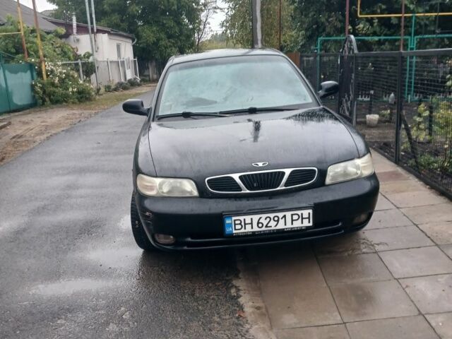 Черный Дэу Нубира, объемом двигателя 1.6 л и пробегом 300 тыс. км за 1000 $, фото 1 на Automoto.ua