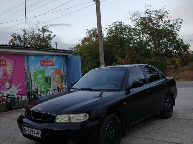 Черный Дэу Нубира, объемом двигателя 1.6 л и пробегом 300 тыс. км за 1000 $, фото 3 на Automoto.ua