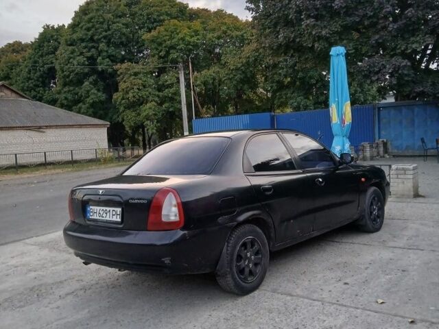 Черный Дэу Нубира, объемом двигателя 1.6 л и пробегом 300 тыс. км за 1000 $, фото 2 на Automoto.ua
