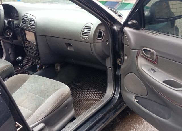 Черный Дэу Нубира, объемом двигателя 1.6 л и пробегом 3 тыс. км за 1650 $, фото 9 на Automoto.ua