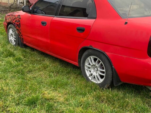 Красный Дэу Нубира, объемом двигателя 1.6 л и пробегом 180 тыс. км за 1050 $, фото 2 на Automoto.ua