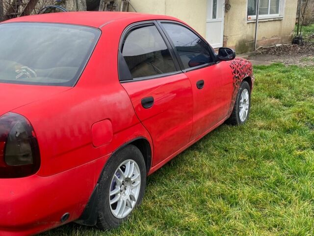 Красный Дэу Нубира, объемом двигателя 1.6 л и пробегом 180 тыс. км за 1050 $, фото 3 на Automoto.ua