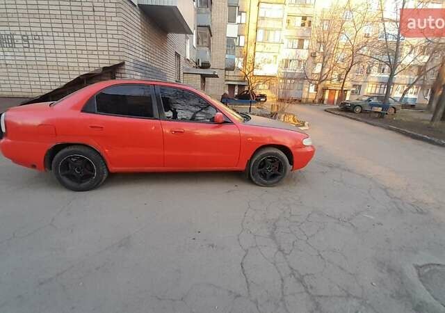 Красный Дэу Нубира, объемом двигателя 1.6 л и пробегом 333 тыс. км за 1500 $, фото 1 на Automoto.ua
