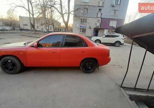 Красный Дэу Нубира, объемом двигателя 1.6 л и пробегом 333 тыс. км за 1500 $, фото 3 на Automoto.ua