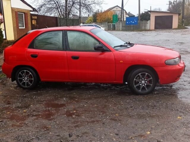 Деу Нубіра 1998 у Люботине на Automoto.ua Червоний Деу Нубіра, об'ємом двигуна 1.6 л та пробігом 225 тис. км за 1800 $, фото 1 на Automoto.ua