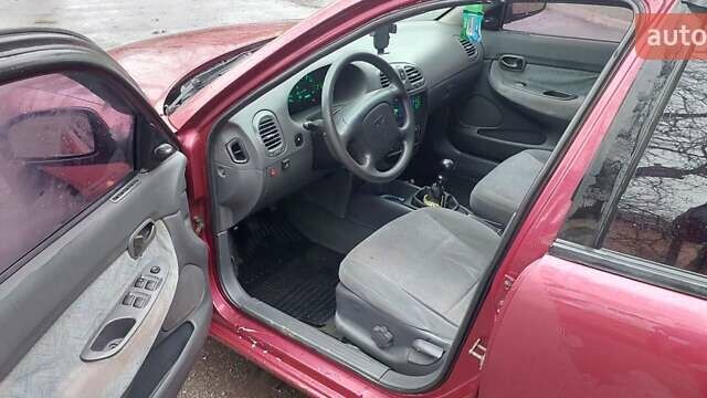 Червоний Деу Нубіра, об'ємом двигуна 1.6 л та пробігом 201 тис. км за 1650 $, фото 6 на Automoto.ua