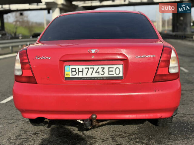 Червоний Деу Нубіра, об'ємом двигуна 1.6 л та пробігом 180 тис. км за 1750 $, фото 5 на Automoto.ua