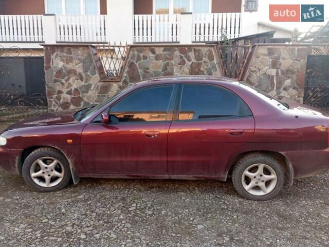 Красный Дэу Нубира, объемом двигателя 1.6 л и пробегом 250 тыс. км за 2100 $, фото 8 на Automoto.ua
