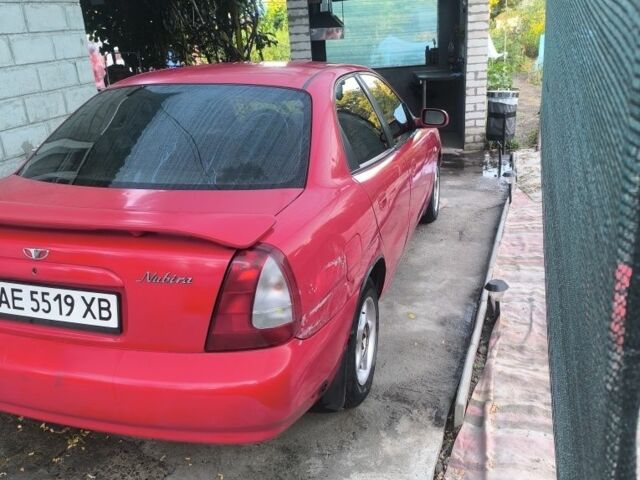Красный Дэу Нубира, объемом двигателя 1.6 л и пробегом 330 тыс. км за 1100 $, фото 3 на Automoto.ua