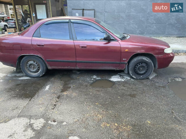 Деу Нубіра 1998 у Києві на Automoto.ua Червоний Деу Нубіра, об'ємом двигуна 1.6 л та пробігом 100 тис. км за 1500 $, фото 6 на Automoto.ua