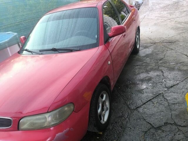 Красный Дэу Нубира, объемом двигателя 1.6 л и пробегом 330 тыс. км за 1100 $, фото 1 на Automoto.ua