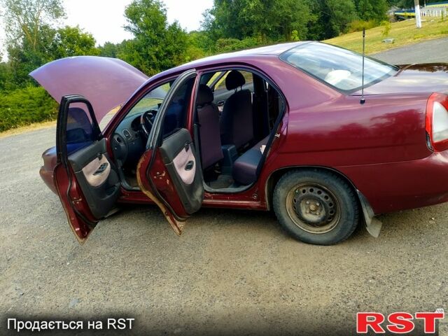 Красный Дэу Нубира, объемом двигателя 1.6 л и пробегом 220 тыс. км за 2500 $, фото 4 на Automoto.ua