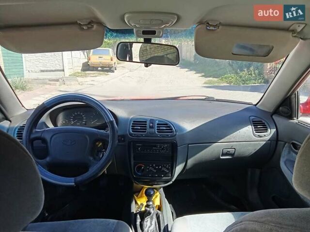 Красный Дэу Нубира, объемом двигателя 1.6 л и пробегом 320 тыс. км за 1700 $, фото 12 на Automoto.ua