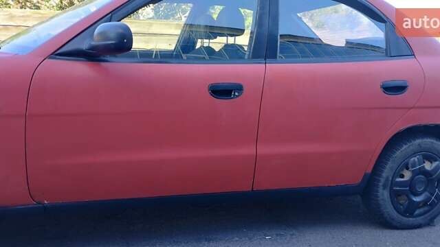 Красный Дэу Нубира, объемом двигателя 1.6 л и пробегом 346 тыс. км за 1500 $, фото 1 на Automoto.ua