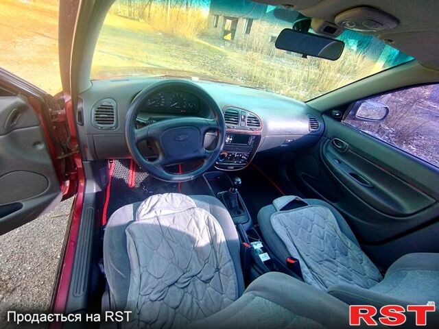 Красный Дэу Нубира, объемом двигателя 1.6 л и пробегом 123 тыс. км за 2250 $, фото 1 на Automoto.ua