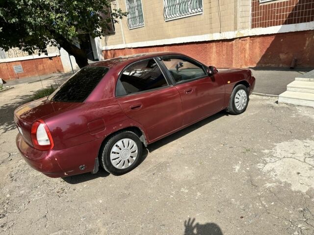 Красный Дэу Нубира, объемом двигателя 1.6 л и пробегом 284 тыс. км за 1600 $, фото 2 на Automoto.ua