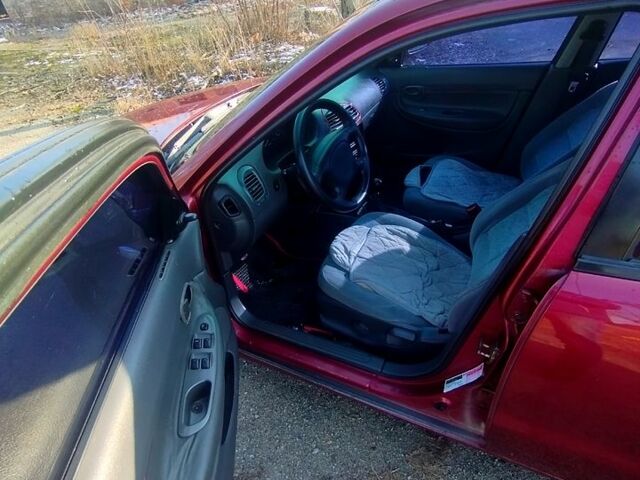 Красный Дэу Нубира, объемом двигателя 1.6 л и пробегом 123 тыс. км за 2250 $, фото 2 на Automoto.ua