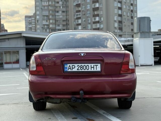 Красный Дэу Нубира, объемом двигателя 1.6 л и пробегом 234 тыс. км за 1650 $, фото 4 на Automoto.ua