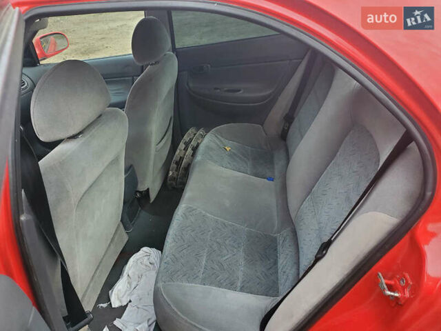 Красный Дэу Нубира, объемом двигателя 1.6 л и пробегом 300 тыс. км за 1400 $, фото 3 на Automoto.ua