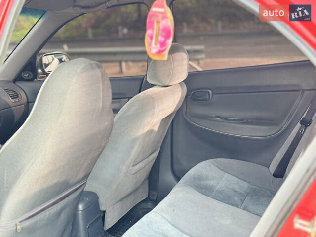 Червоний Деу Нубіра, об'ємом двигуна 1.6 л та пробігом 180 тис. км за 1750 $, фото 9 на Automoto.ua