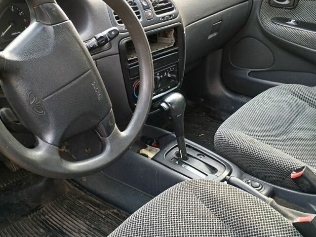 Красный Дэу Нубира, объемом двигателя 2 л и пробегом 200 тыс. км за 1100 $, фото 3 на Automoto.ua