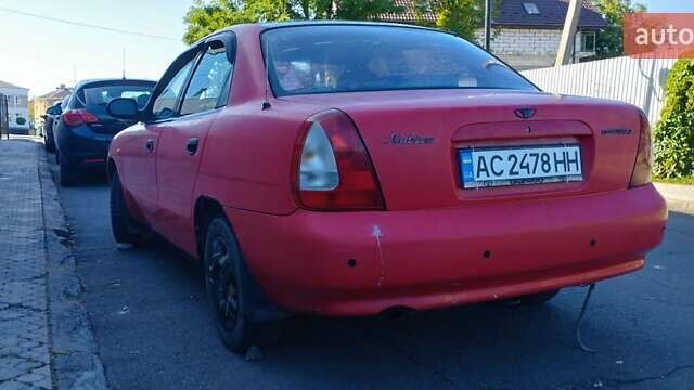 Красный Дэу Нубира, объемом двигателя 1.6 л и пробегом 346 тыс. км за 1500 $, фото 3 на Automoto.ua