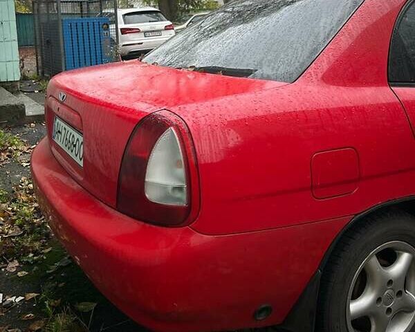 Червоний Деу Нубіра, об'ємом двигуна 1.6 л та пробігом 230 тис. км за 1100 $, фото 4 на Automoto.ua