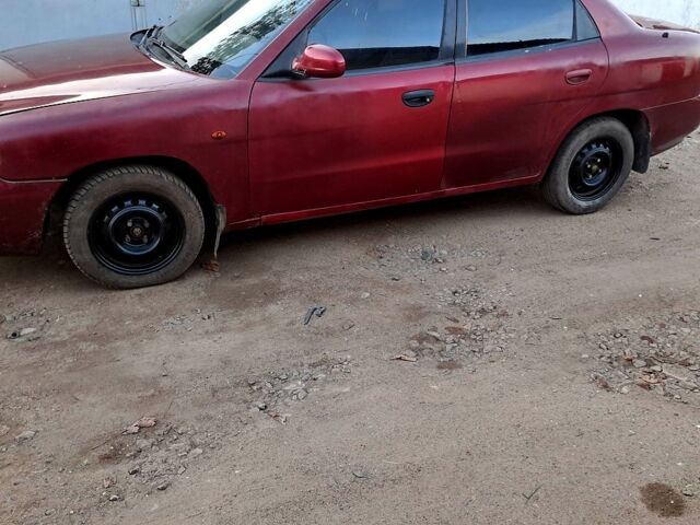 Красный Дэу Нубира, объемом двигателя 1.6 л и пробегом 580 тыс. км за 1100 $, фото 1 на Automoto.ua