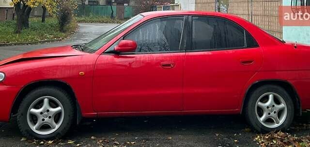 Червоний Деу Нубіра, об'ємом двигуна 1.6 л та пробігом 230 тис. км за 1100 $, фото 3 на Automoto.ua