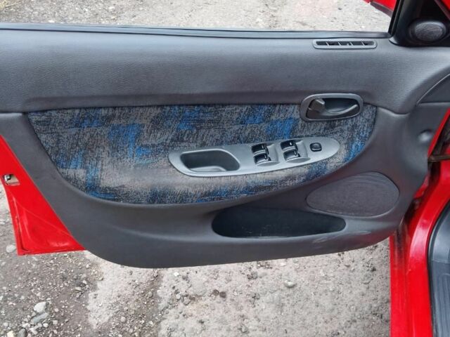 Червоний Деу Нубіра, об'ємом двигуна 1.6 л та пробігом 390 тис. км за 1939 $, фото 5 на Automoto.ua