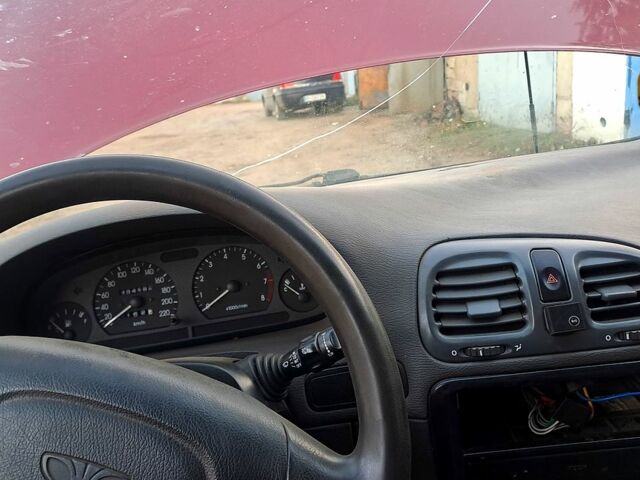 Красный Дэу Нубира, объемом двигателя 1.6 л и пробегом 580 тыс. км за 1100 $, фото 7 на Automoto.ua