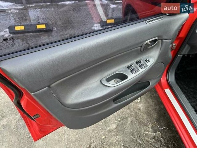 Червоний Деу Нубіра, об'ємом двигуна 1.6 л та пробігом 331 тис. км за 2350 $, фото 4 на Automoto.ua