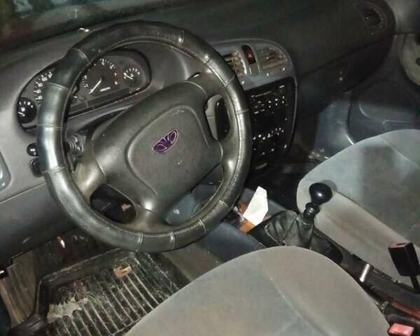 Красный Дэу Нубира, объемом двигателя 1.6 л и пробегом 250 тыс. км за 750 $, фото 3 на Automoto.ua