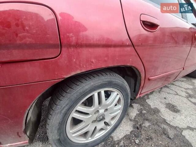 Красный Дэу Нубира, объемом двигателя 2 л и пробегом 350 тыс. км за 1500 $, фото 6 на Automoto.ua