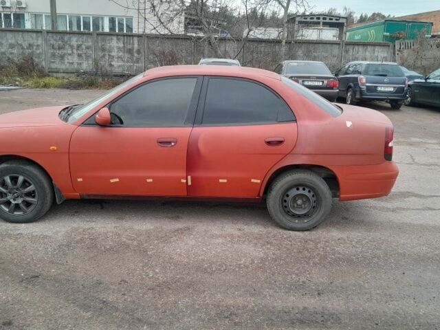 Червоний Деу Нубіра, об'ємом двигуна 2 л та пробігом 321 тис. км за 1600 $, фото 2 на Automoto.ua