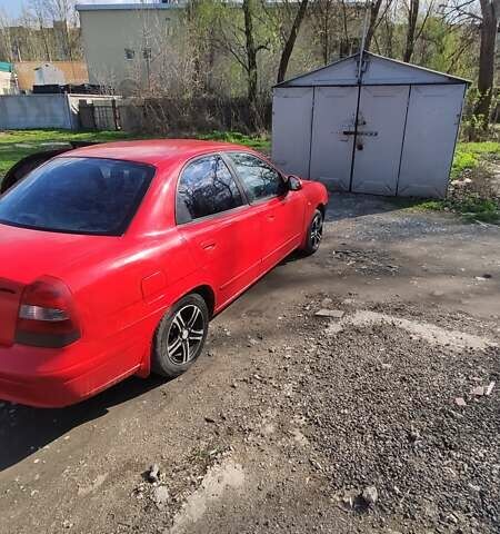Красный Дэу Нубира, объемом двигателя 2 л и пробегом 300 тыс. км за 1750 $, фото 4 на Automoto.ua