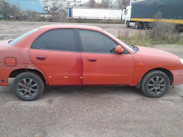 Червоний Деу Нубіра, об'ємом двигуна 2 л та пробігом 321 тис. км за 1600 $, фото 3 на Automoto.ua