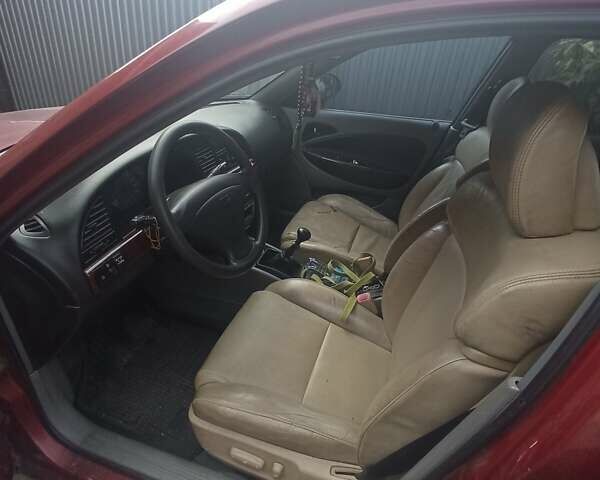 Красный Дэу Нубира, объемом двигателя 2 л и пробегом 260 тыс. км за 2100 $, фото 4 на Automoto.ua