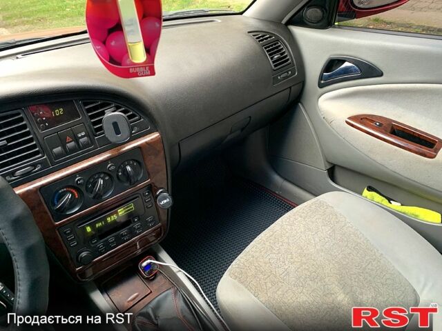 Красный Дэу Нубира, объемом двигателя 2 л и пробегом 314 тыс. км за 3000 $, фото 6 на Automoto.ua