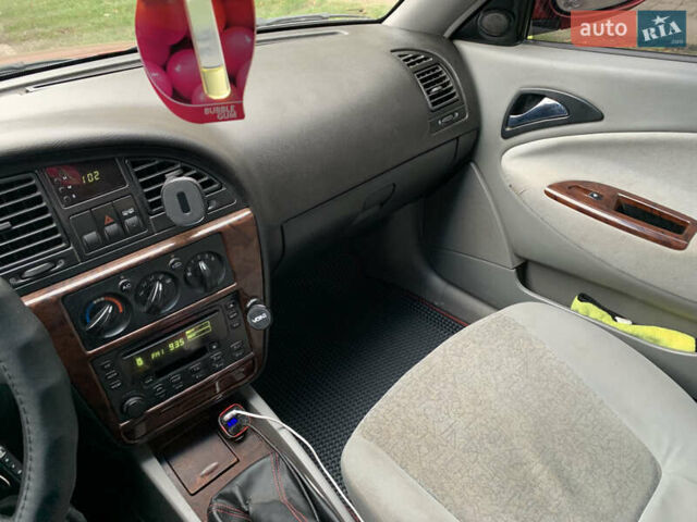 Красный Дэу Нубира, объемом двигателя 2 л и пробегом 314 тыс. км за 3000 $, фото 3 на Automoto.ua