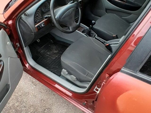 Червоний Деу Нубіра, об'ємом двигуна 2 л та пробігом 321 тис. км за 1600 $, фото 4 на Automoto.ua