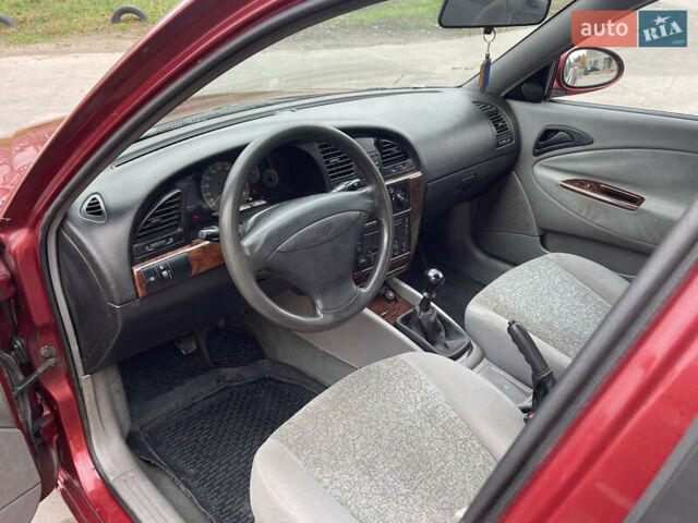 Красный Дэу Нубира, объемом двигателя 2 л и пробегом 150 тыс. км за 2450 $, фото 6 на Automoto.ua